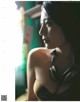 A woman wearing headphones in a magazine article.